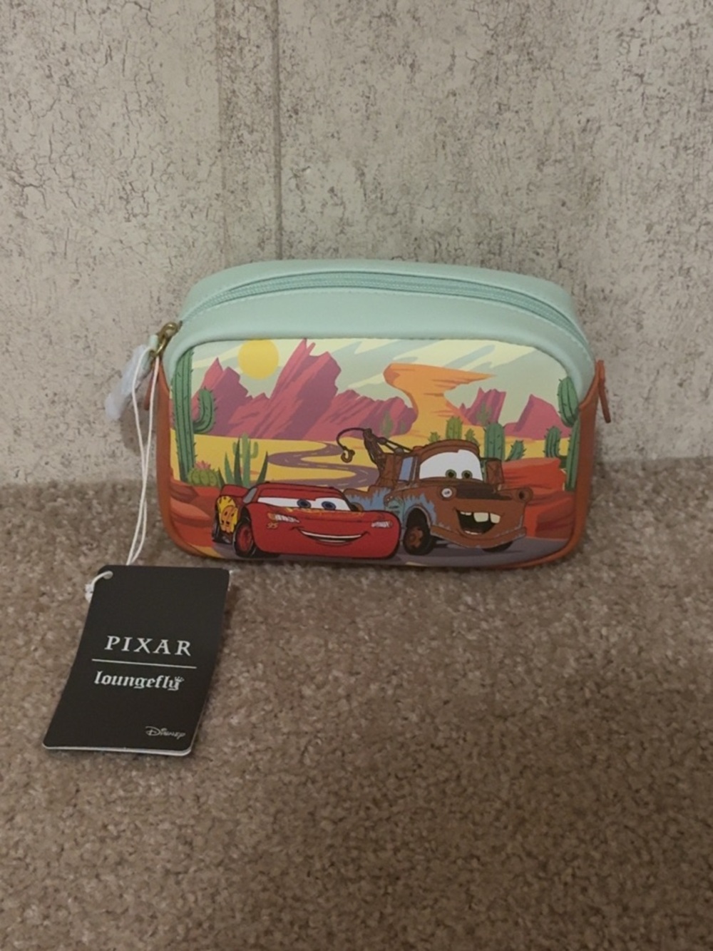 Loungefly
Cars Mint Green & Orange Cosmetic Pouch